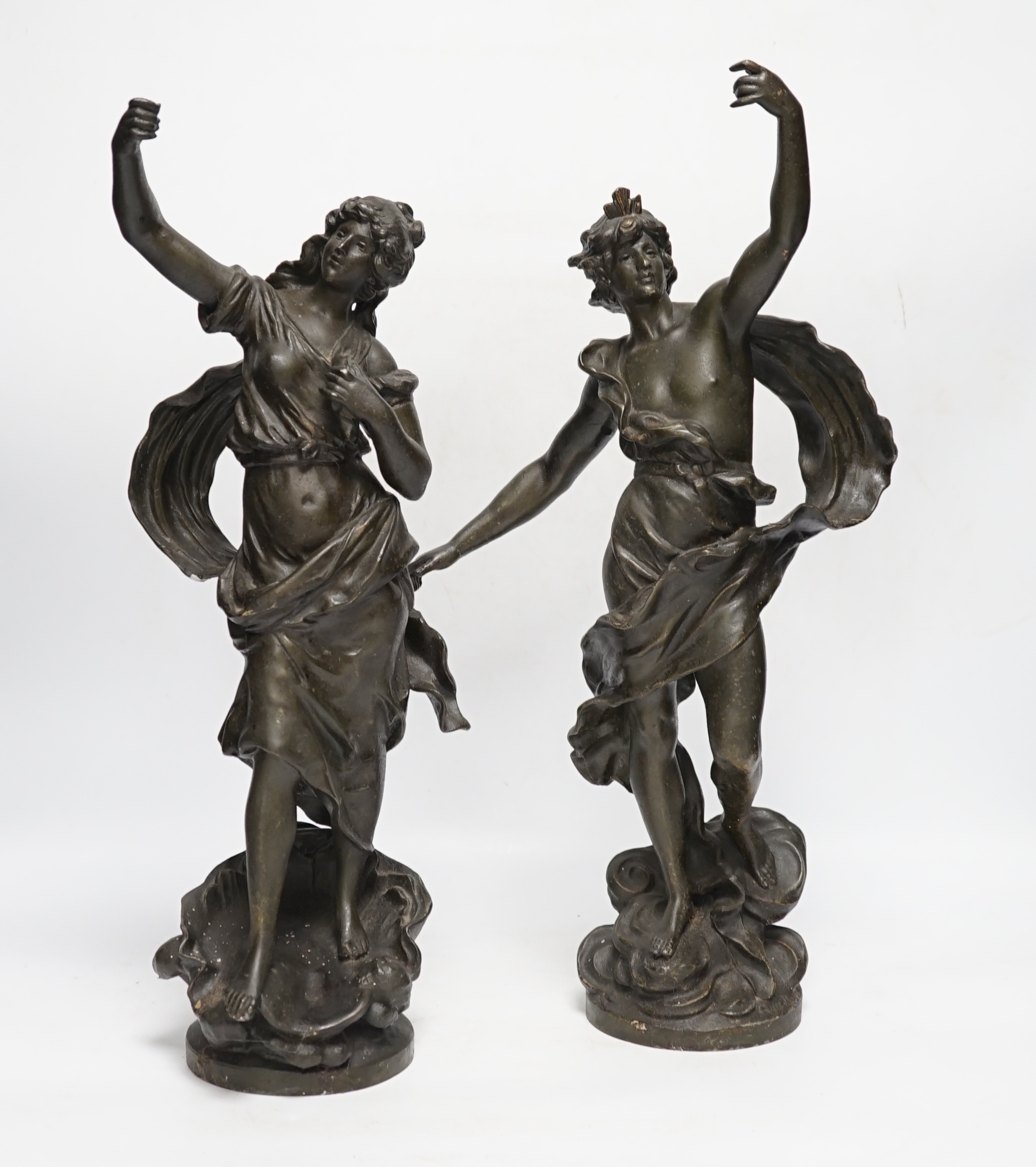 A pair of patinated spelter figures, 47cm